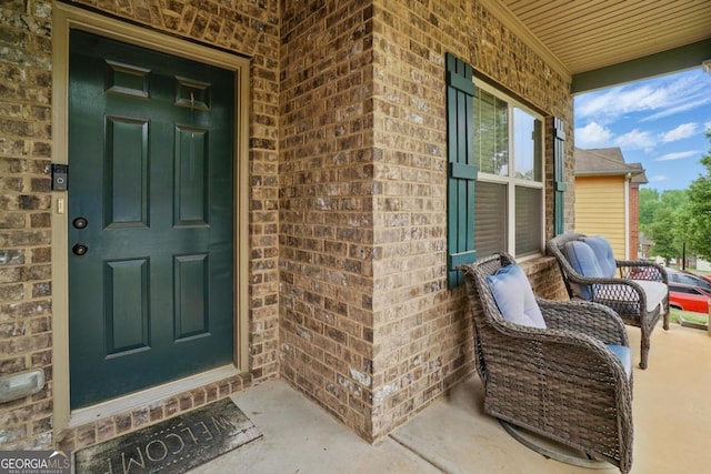 11028 Southwood Dr, Hampton, GA 30228 - property entrance with a porch and brick siding