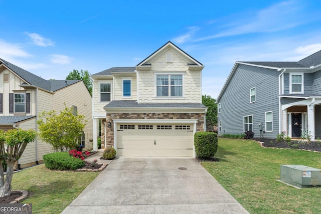 traditional-style house featuring a garage, a front yard, stone siding, and concrete driveway