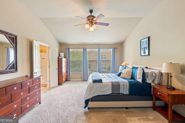 bedroom featuring visible vents, ceiling fan, vaulted ceiling, and light carpet