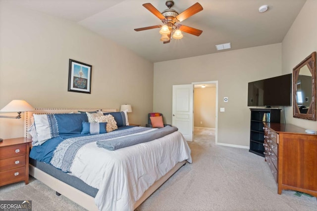 bedroom featuring ceiling fan, visible vents, light colored carpet, baseboards, and lofted ceiling