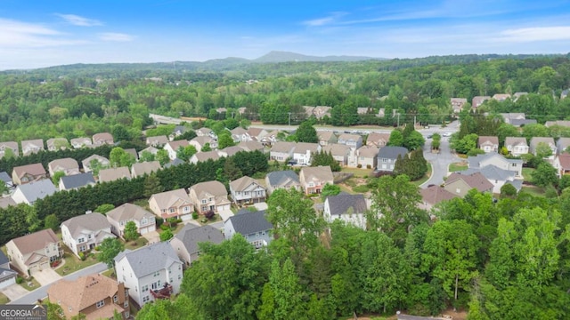 bird's eye view featuring a residential view and a forest view