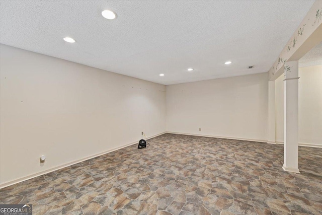 115 Old Ridge Rd, Macon, GA 31211 - finished basement featuring recessed lighting, a textured ceiling, baseboards, and stone floors