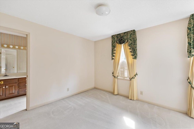 115 Old Ridge Rd, Macon, GA 31211 - unfurnished bedroom featuring light colored carpet, baseboards, and ensuite bathroom