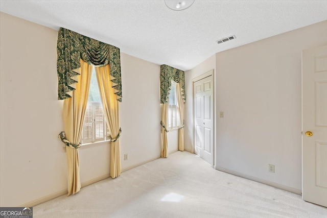 115 Old Ridge Rd, Macon, GA 31211 - interior space featuring carpet floors, a textured ceiling, visible vents, and baseboards