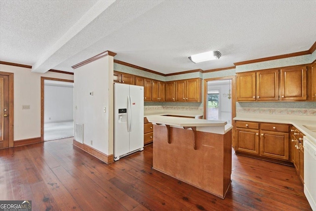 115 Old Ridge Rd, Macon, GA 31211 - kitchen featuring light countertops, white fridge with ice dispenser, brown cabinets, and a textured ceiling
