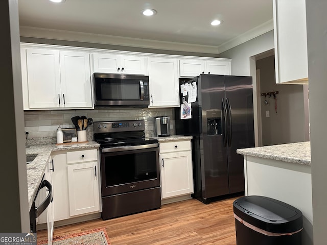 20 Wagon Trl, Mansfield, GA 30055 - kitchen featuring crown molding, decorative backsplash, white cabinets, and black appliances