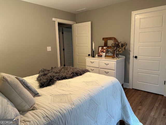 20 Wagon Trl, Mansfield, GA 30055 - bedroom featuring baseboards, dark wood finished floors, and visible vents