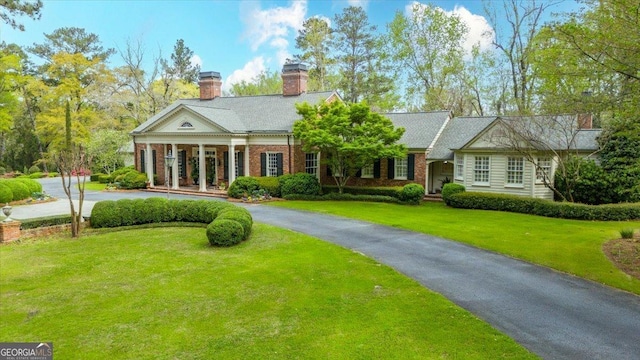 2727 Ingleside Ave, Macon, GA 31204 - greek revival house with a chimney, brick siding, and a front yard