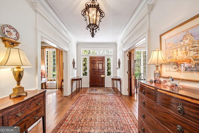 2727 Ingleside Ave, Macon, GA 31204 - entryway featuring a healthy amount of sunlight, crown molding, and light wood-style flooring
