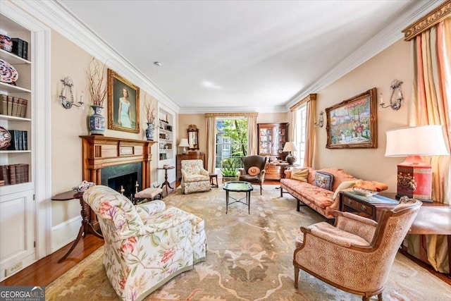 2727 Ingleside Ave, Macon, GA 31204 - living room featuring built in features, ornamental molding, a fireplace, and wood finished floors