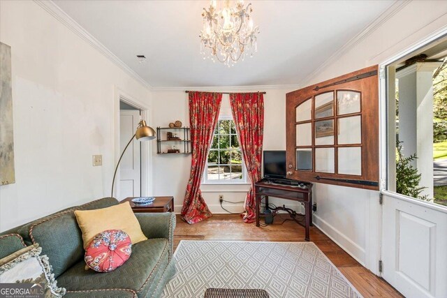 2727 Ingleside Ave, Macon, GA 31204 - sitting room with baseboards, a chandelier, ornamental molding, and wood finished floors
