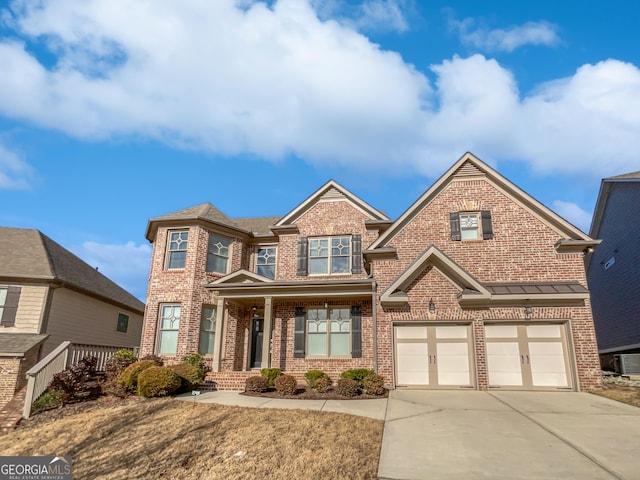 craftsman-style house featuring a garage, a porch, driveway, and brick siding