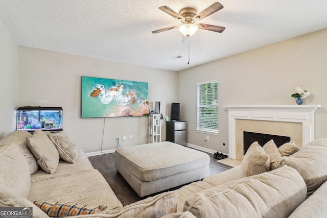 4015 Soaring Dr, Douglasville, GA 30135 - living room with baseboards, a ceiling fan, wood finished floors, and a high end fireplace