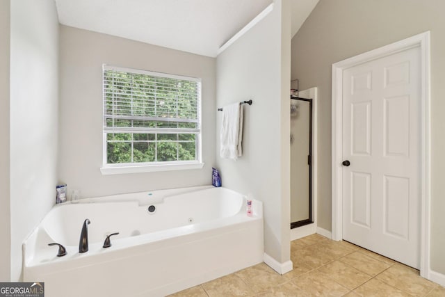 4015 Soaring Dr, Douglasville, GA 30135 - bathroom with a jetted tub, tile patterned flooring, baseboards, and a stall shower