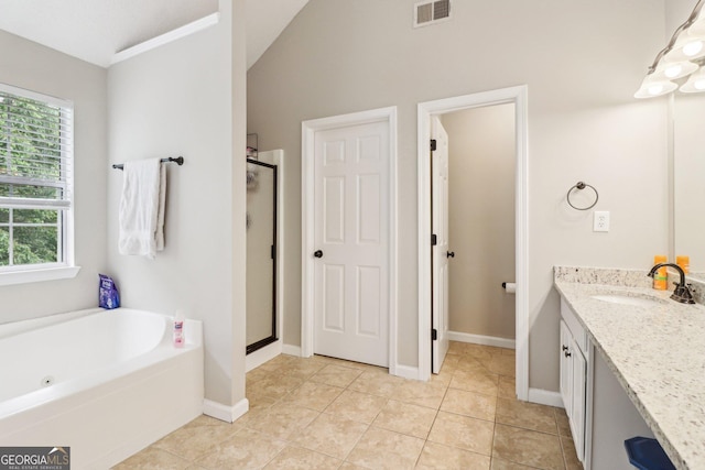 4015 Soaring Dr, Douglasville, GA 30135 - bathroom with vanity, a shower stall, lofted ceiling, and visible vents