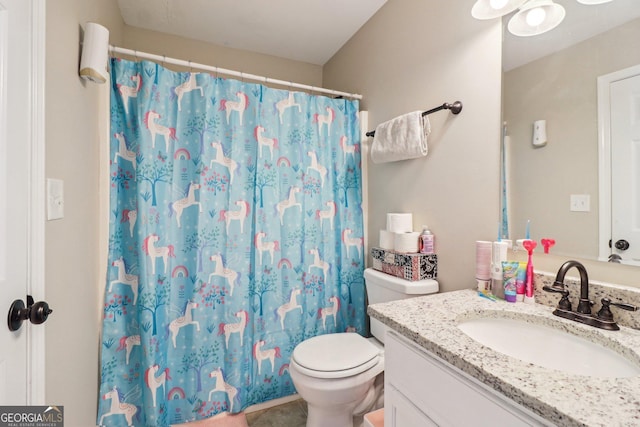 4015 Soaring Dr, Douglasville, GA 30135 - bathroom featuring toilet, curtained shower, and vanity
