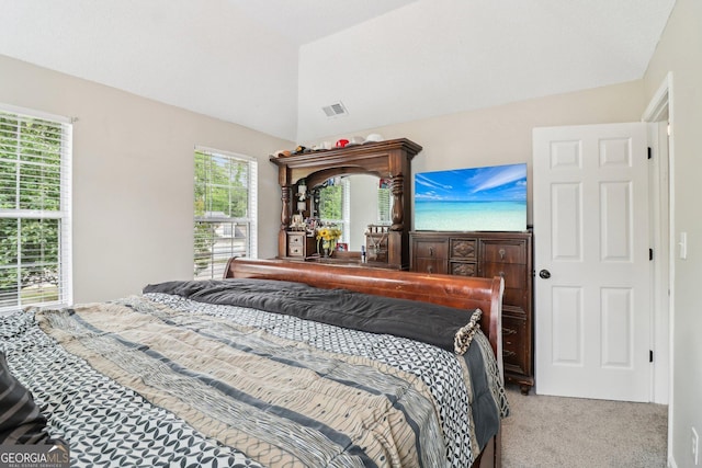 4015 Soaring Dr, Douglasville, GA 30135 - bedroom with visible vents, lofted ceiling, and light carpet