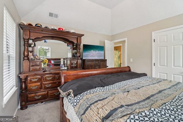 4015 Soaring Dr, Douglasville, GA 30135 - carpeted bedroom with lofted ceiling and visible vents