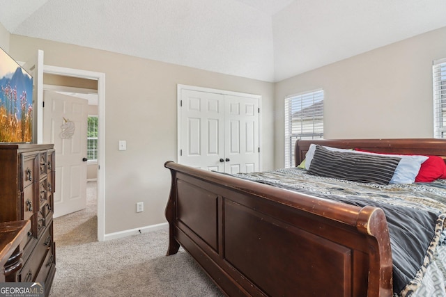 4015 Soaring Dr, Douglasville, GA 30135 - bedroom with baseboards, a closet, and light carpet
