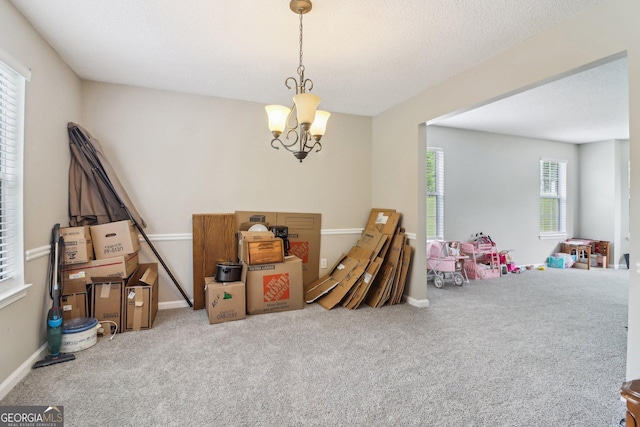 4015 Soaring Dr, Douglasville, GA 30135 - playroom with an inviting chandelier, carpet, and baseboards