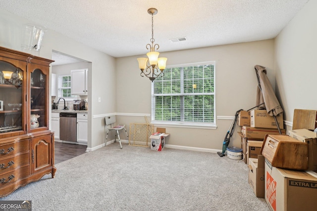 4015 Soaring Dr, Douglasville, GA 30135 - interior space with a notable chandelier, carpet floors, a textured ceiling, baseboards, and visible vents