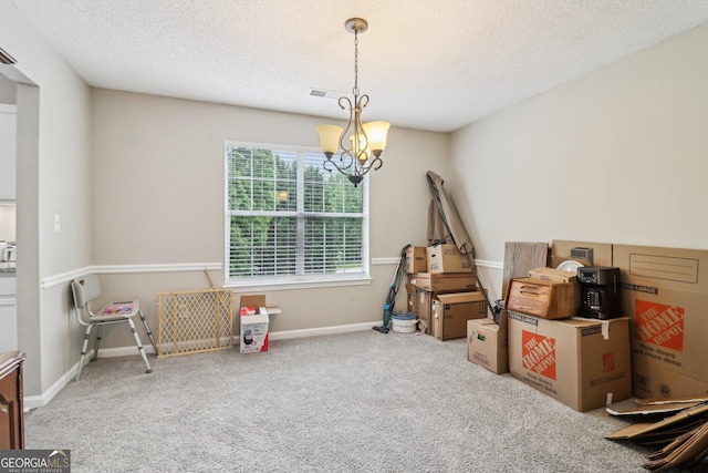 4015 Soaring Dr, Douglasville, GA 30135 - interior space featuring visible vents, baseboards, a textured ceiling, a chandelier, and carpet