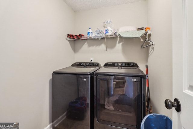 4015 Soaring Dr, Douglasville, GA 30135 - washroom featuring a textured ceiling, laundry area, and independent washer and dryer