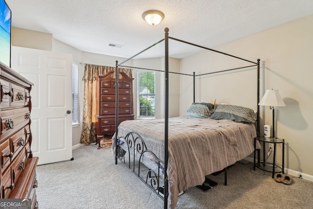 4015 Soaring Dr, Douglasville, GA 30135 - bedroom featuring a textured ceiling, baseboards, visible vents, and carpet