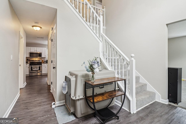 4015 Soaring Dr, Douglasville, GA 30135 - foyer entrance featuring baseboards, dark wood-style floors, and stairs