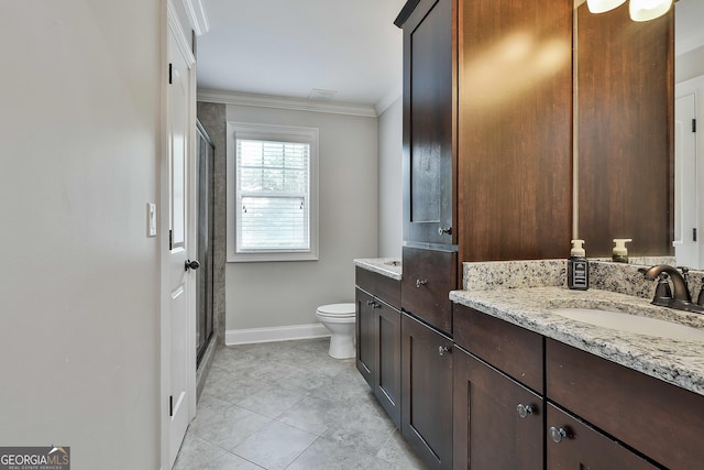 full bathroom with vanity, ornamental molding, toilet, baseboards, and a shower stall