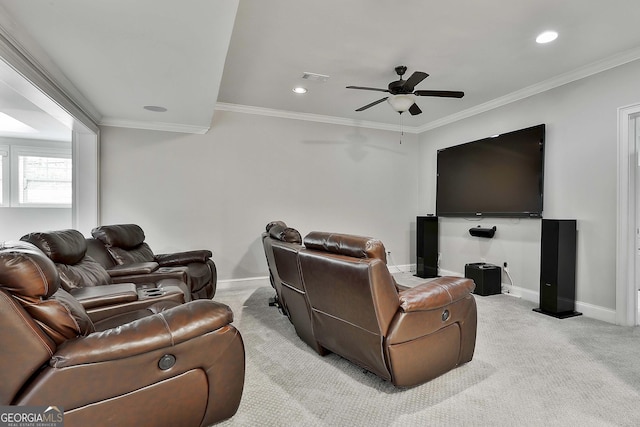 cinema room with baseboards, ceiling fan, light carpet, and visible vents