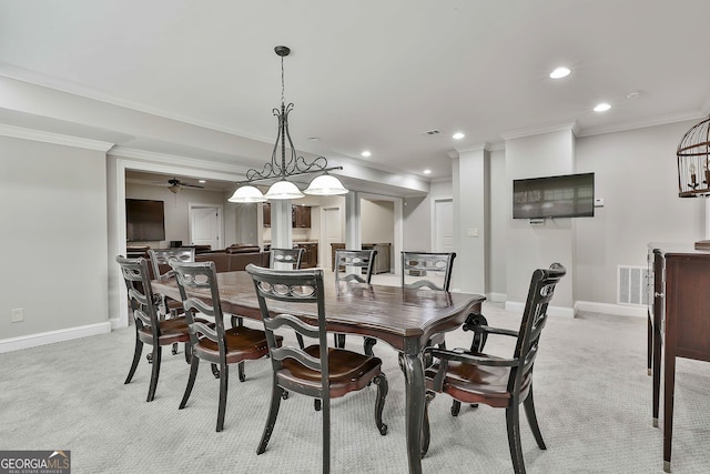 dining space featuring recessed lighting, baseboards, light colored carpet, and ornamental molding