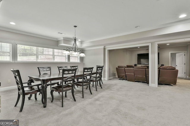 dining space with baseboards, ornamental molding, light carpet, and recessed lighting