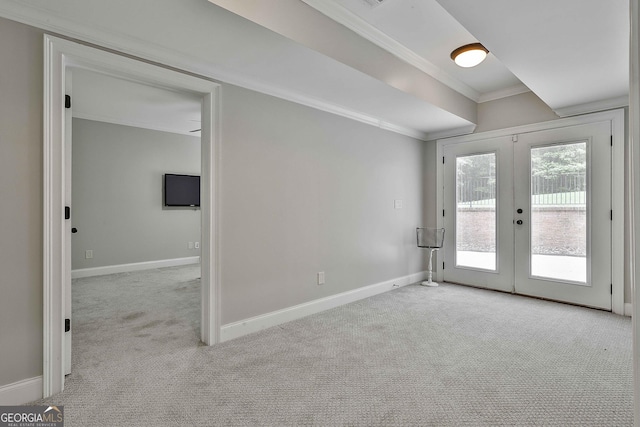 interior space with crown molding, baseboards, and french doors