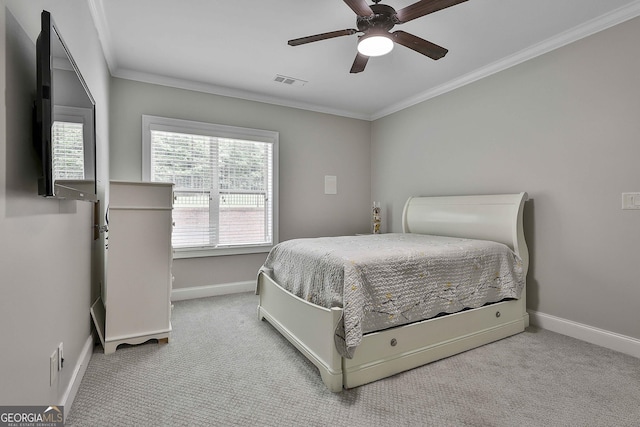bedroom featuring crown molding, baseboards, carpet floors, and visible vents
