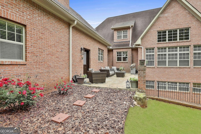 exterior space with an outdoor living space and a patio area