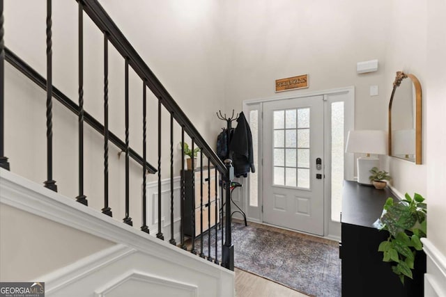 188 Lookout Way, Dallas, GA 30132 - foyer featuring baseboards, a towering ceiling, wood finished floors, and stairway