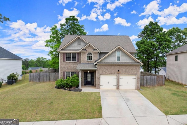 188 Lookout Way, Dallas, GA 30132 - view of front facade with brick siding, fence, driveway, and a front yard