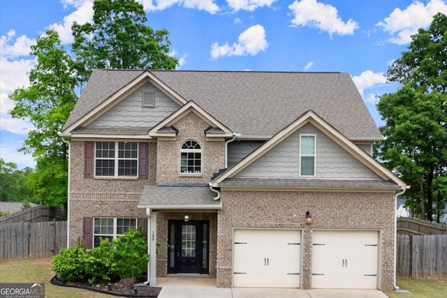188 Lookout Way, Dallas, GA 30132 - craftsman inspired home featuring brick siding, roof with shingles, fence, and driveway