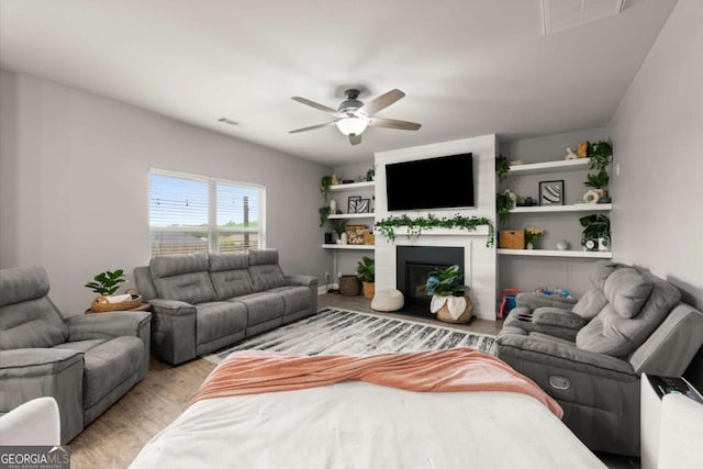 188 Lookout Way, Dallas, GA 30132 - living area featuring visible vents, a ceiling fan, a large fireplace, and light wood-type flooring