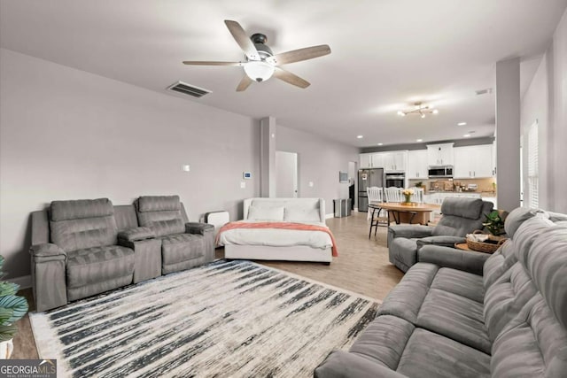 188 Lookout Way, Dallas, GA 30132 - living room featuring ceiling fan, visible vents, light wood-type flooring, baseboards, and recessed lighting