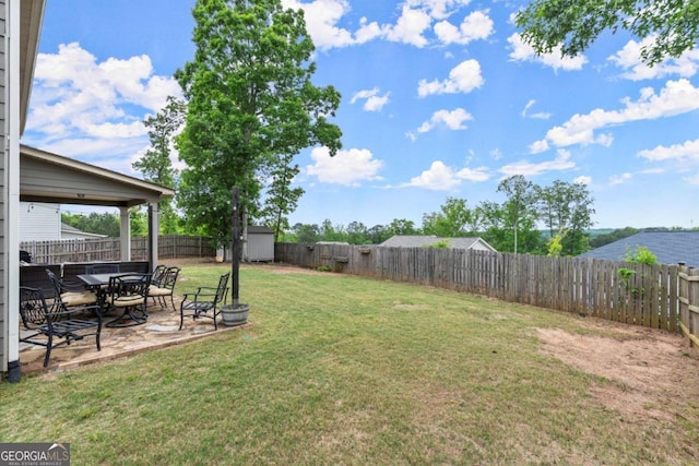 188 Lookout Way, Dallas, GA 30132 - view of yard featuring an outdoor structure, a patio, a storage shed, and a fenced backyard