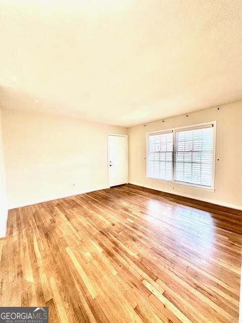 135 E Hill St Unit 12, Decatur, GA 30030 - unfurnished room with wood finished floors