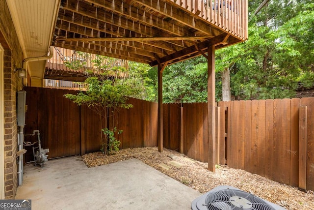 view of patio featuring fence and central air condition unit