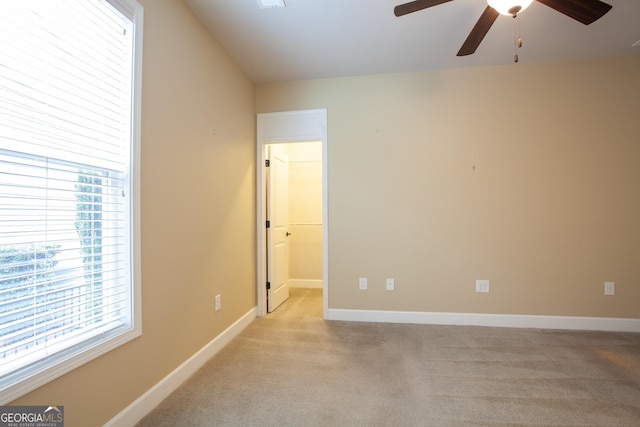 3508 Blue Spruce Ct SW, Gainesville, GA 30504 - unfurnished room with a ceiling fan, plenty of natural light, light colored carpet, and baseboards