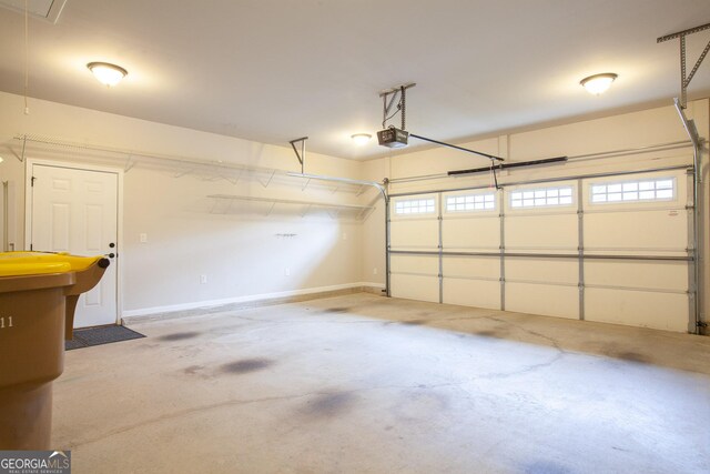 3508 Blue Spruce Ct SW, Gainesville, GA 30504 - garage with a garage door opener and baseboards