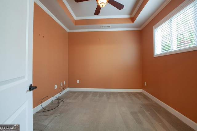 3508 Blue Spruce Ct SW, Gainesville, GA 30504 - spare room featuring light colored carpet, a ceiling fan, a tray ceiling, ornamental molding, and baseboards