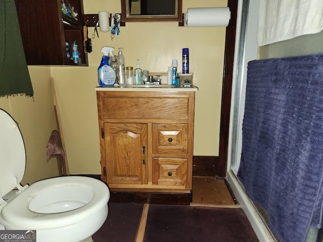 3976 Mosley Dr, Columbus, GA 31903 - full bathroom with a stall shower, vanity, and toilet