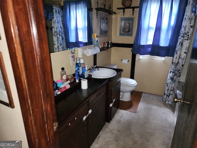 3976 Mosley Dr, Columbus, GA 31903 - bathroom featuring vanity, toilet, and curtained shower