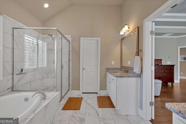 bathroom featuring vanity, a garden tub, baseboards, and a stall shower